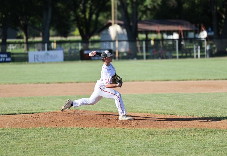Hartman throws a pitch from the pitcher's mound during a game.