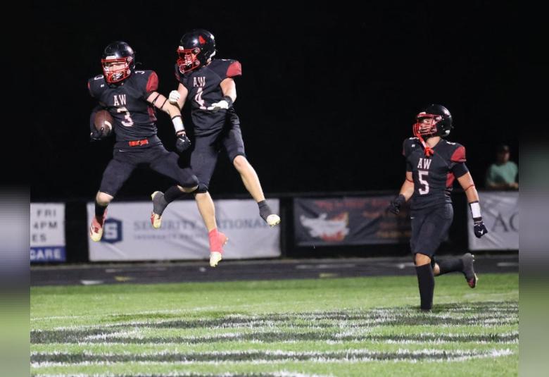  Westerner football players, Cooper Iseminger, #3, Ben St. Pierre,#4, and Ronan Higman, #5, celebrate a touchdown during Friday’s homecoming game.