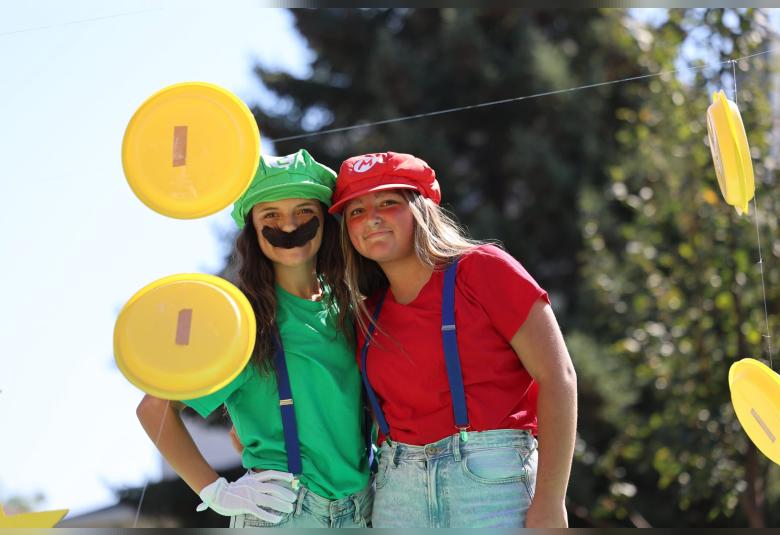 Zoie Horn and Lux Larson dress as Luigi and Mario as part of Friday’s homecoming parade festivities.