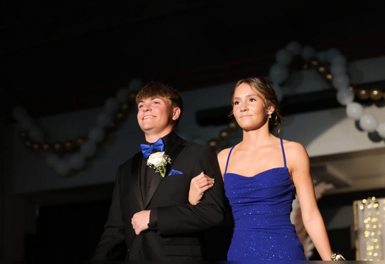 Tayte Colt escorts Anna Vollink in the Grand March proceedings.