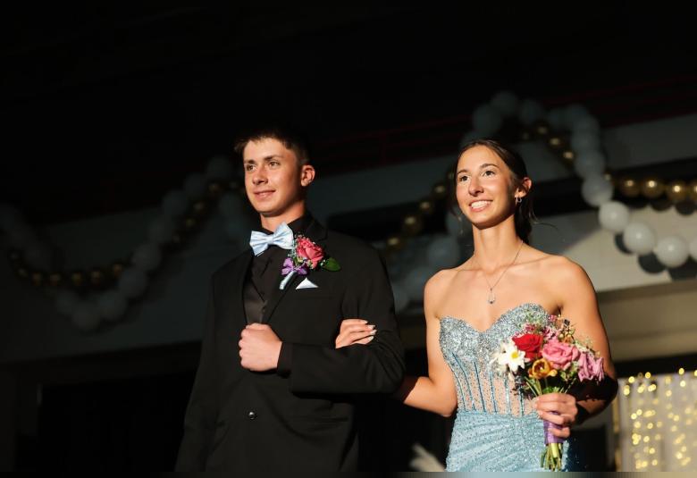 Jackson Neubrand and Peyton Small walk in the Grand March.