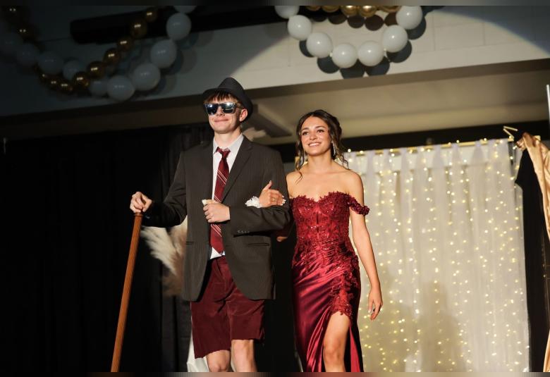 Aiden Petersen escorts Ella Medina in the Grand March festivities.