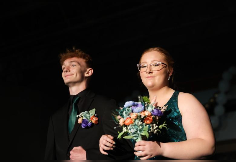 Archer Small and MaKenna Combs walk in the Grand March.