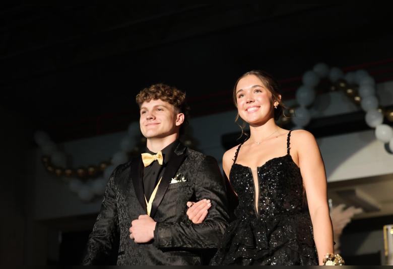 Alex Baker and Kate Solberg take part in Grand March.