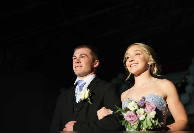 Hunter Henrich escorts Josie Jacobs in the Grand March.