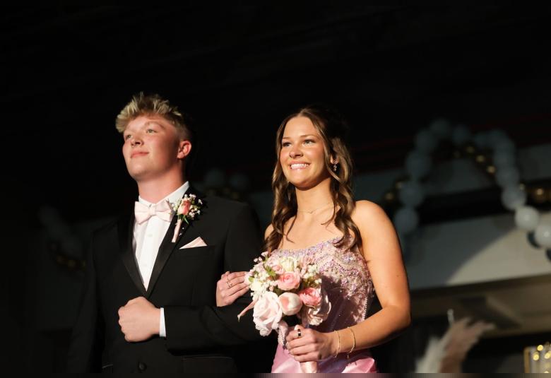 Braydon Kusler and Brylie Johnson take part in the Grand March.