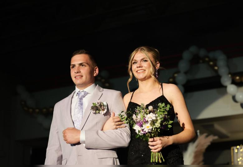 Daynen McKee escorts Kelsey Saathoff in the Grand March.