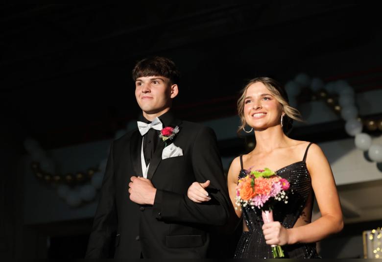 Reegan McKee escorts Allie Swoyer in Saturday’s Grand March.