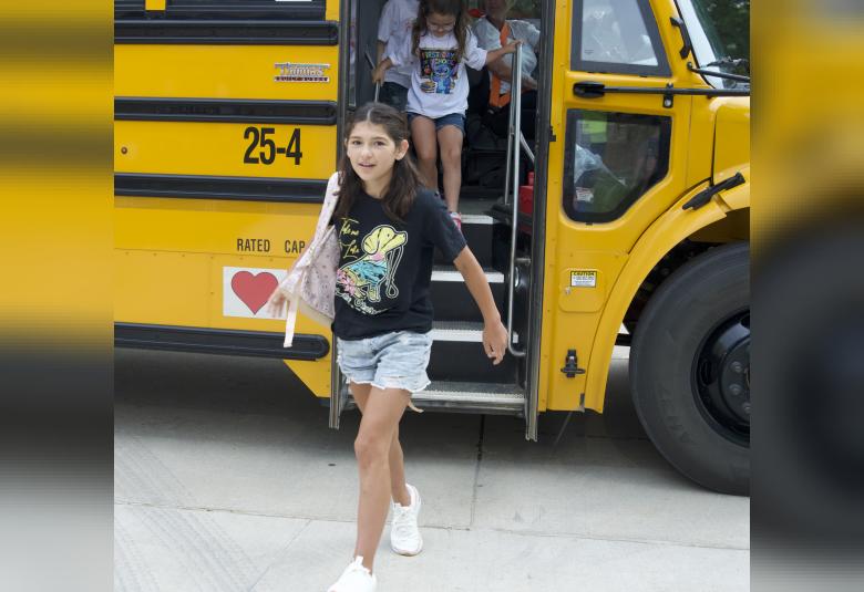 Gloria Hansen was all smiles as she stepped off the school bus on Friday morning.
