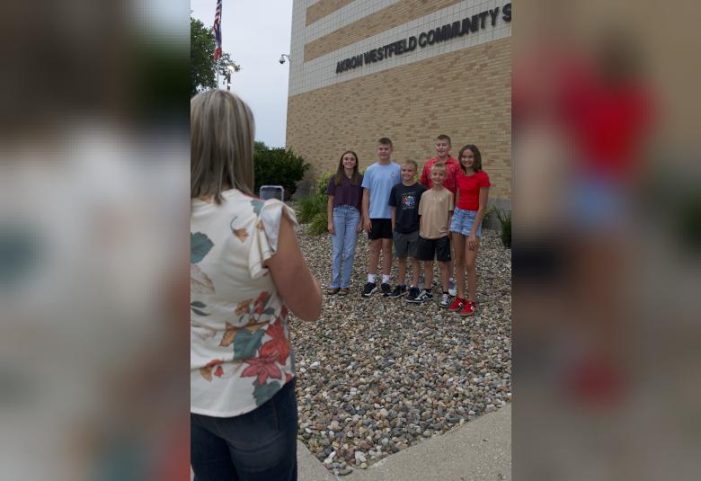 Layla Rozell, Luke Hughes, Will Rozell, Max Rozell, Jack Hughes, and Kenli Rozell, gather for a group photo before heading in to start the 2025-2026 school year.