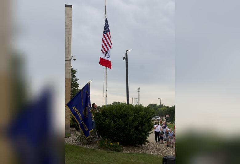 The American Flag is raised by Akron-Westfield seniors Peyton VanderHelm, Reegan McKee, and Callie Jager.
