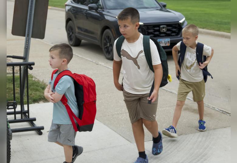 Ryne, Graysen, and Lawsen Schuch were all business as they head into school with their backpacks in tow.