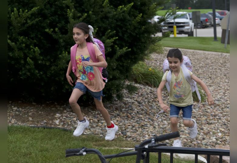 Sisters, Lyanna and Dani Dahl-Krentz were so excited to get to school they made a dash for the front door.